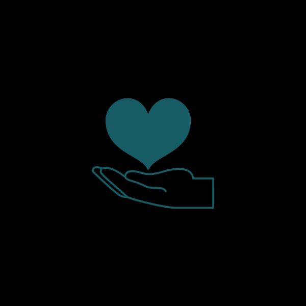 A hand holding a heart symbol